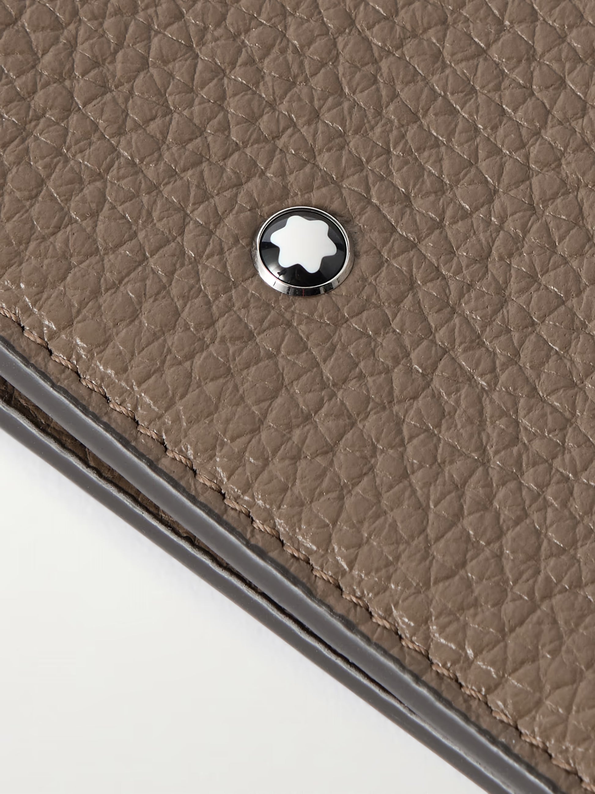 Montblanc snow cap emblem on full grain calf leather wallet detail