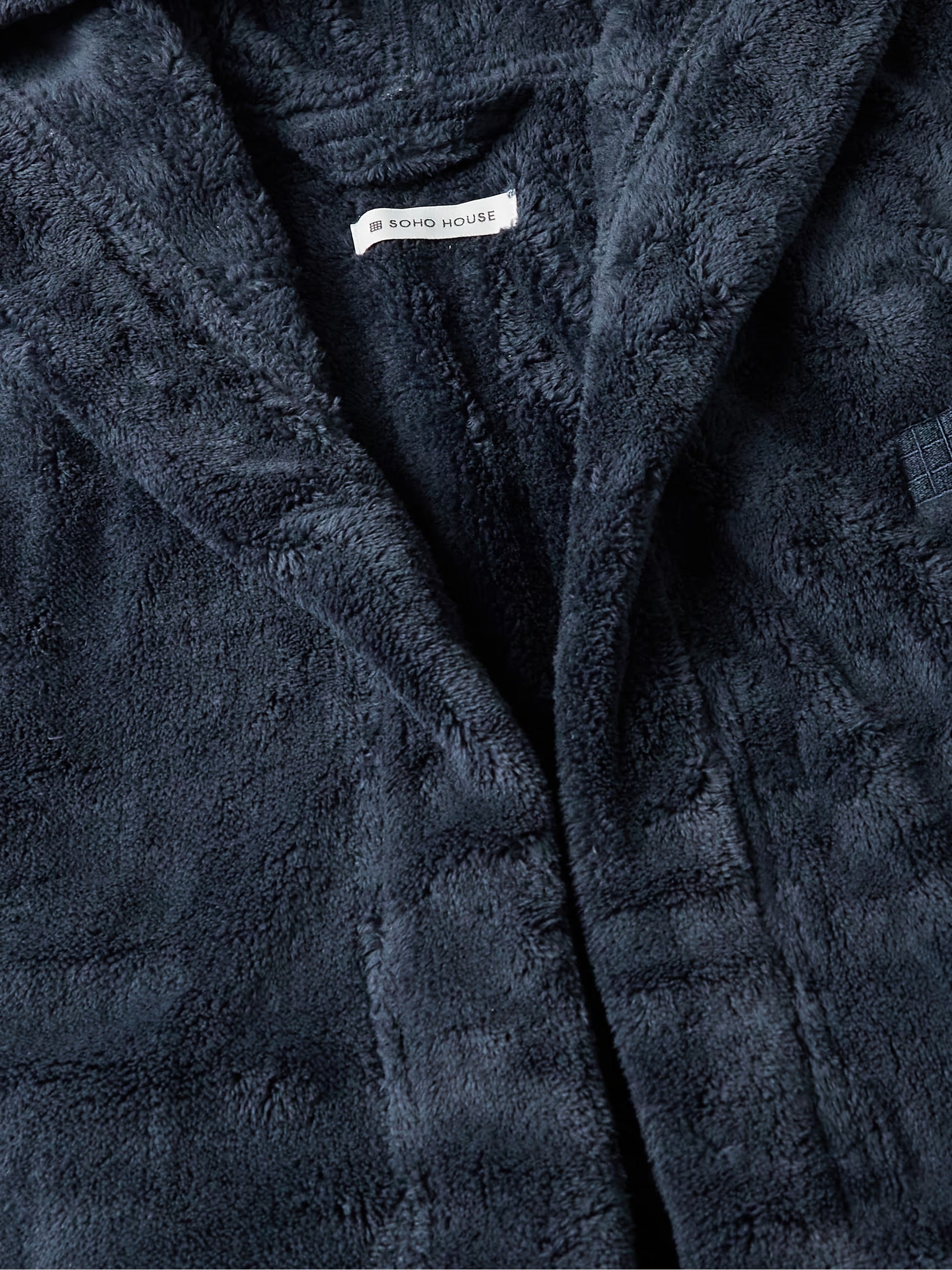 Soho Home logo embroidered on navy hooded robe men chest detail
