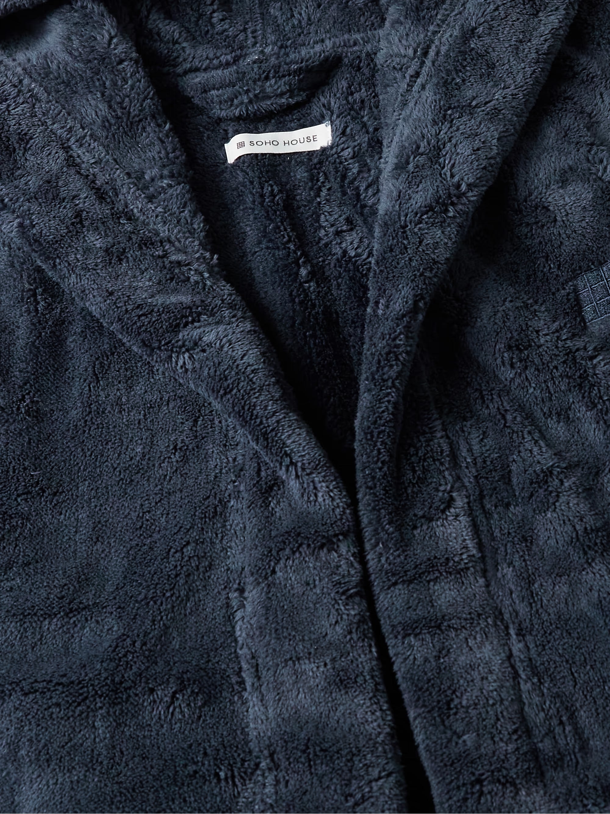 Soho Home logo embroidered on navy hooded robe men chest detail
