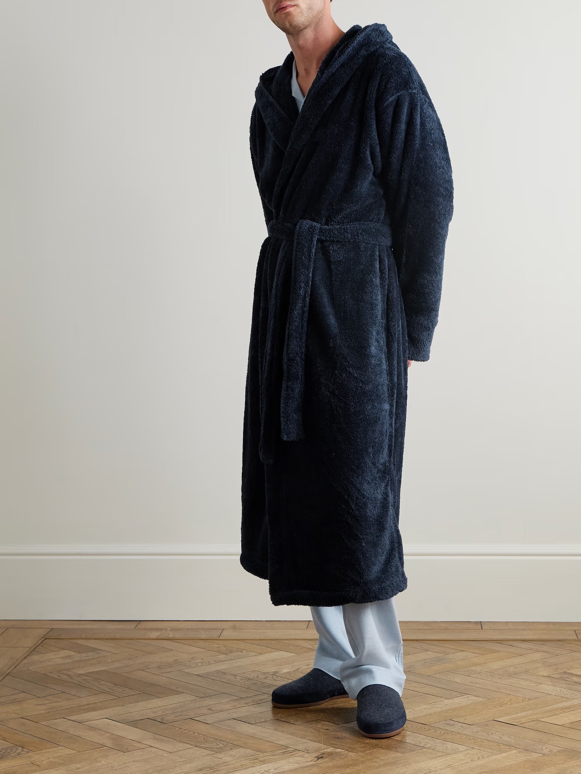 an wearing Soho Home hooded fleece robe in navy - luxury gift for him