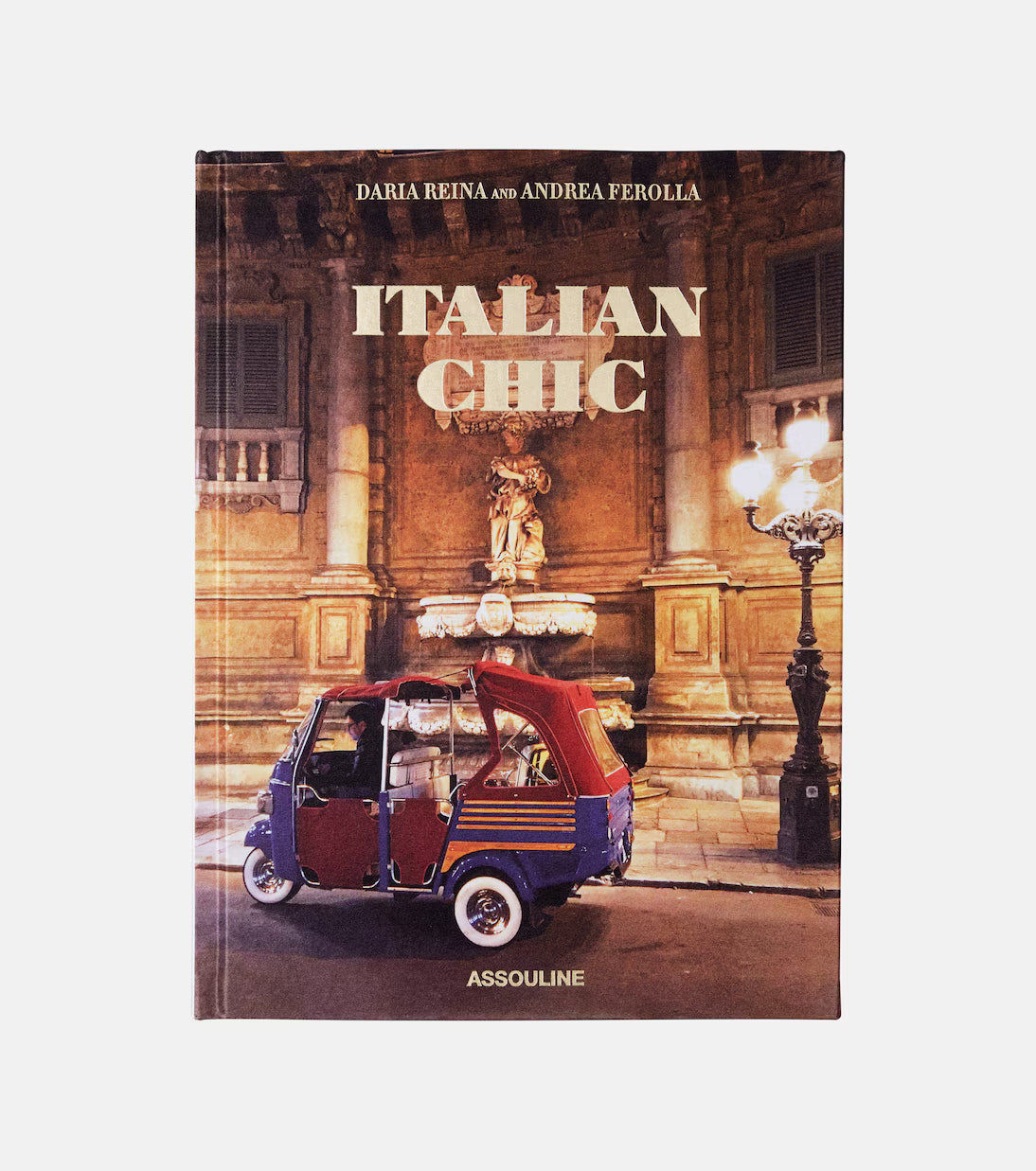 Book titled 'Italian Chic' by Daria Reina and Andrea Ferolla with a vintage Italian vehicle on the cover.