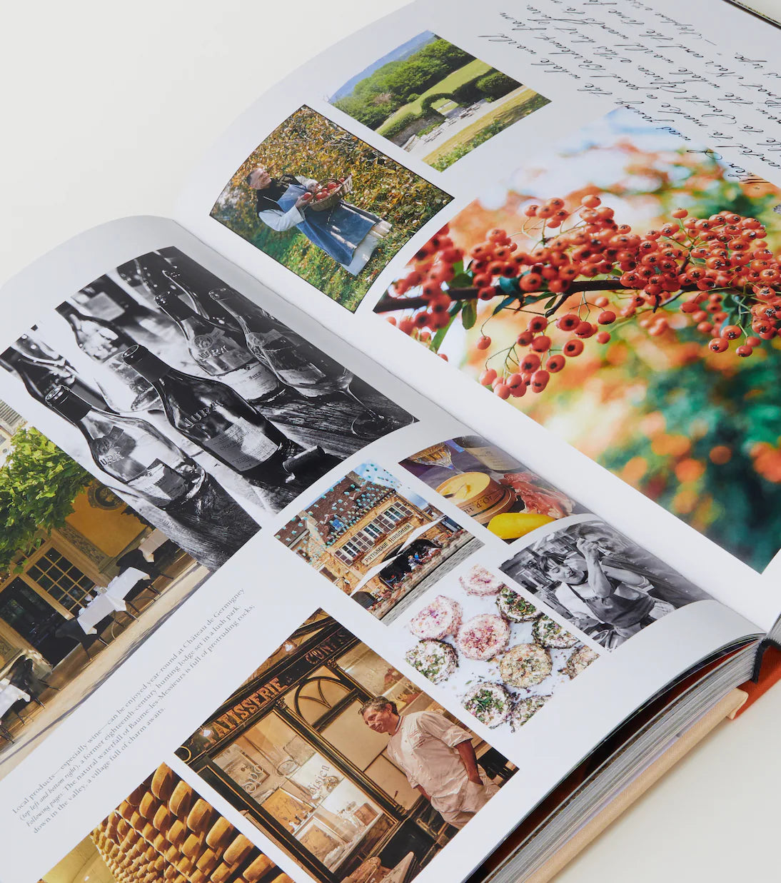 Open book with various images including landscapes, people, and architecture.