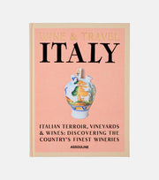 Book cover of 'Wine & Travel Italy' by Assouline on a light pink background