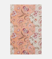 Floral patterned fabric swatch on a peach background