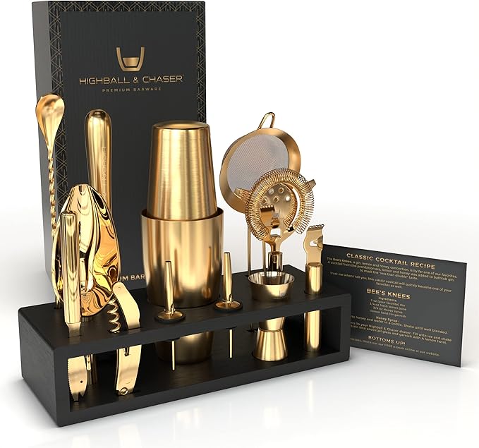 Gold cocktail bar set with accessories on a black stand, featuring 'Highball & Chaser' branding.