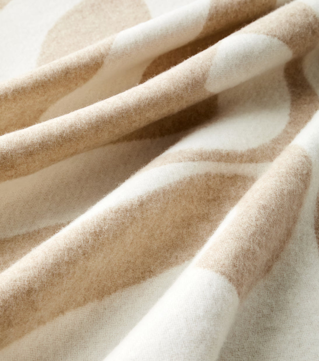 Close-up of Loewe Anagram blanket showing jacquard weave and cashmere texture