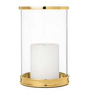 Ralph Lauren Home Mini Modern Hurricane on a mantlepiece with a lit pillar candle