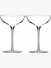 Two clear martini glasses on a white background